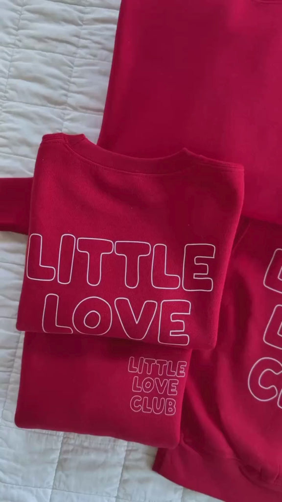 Video of Adult and Child sweater in red with "Little Love Club" and "Mom Love Club" bubble letter text design on front left chest and back, shown on flat lay – Little Mama Shirt Shop